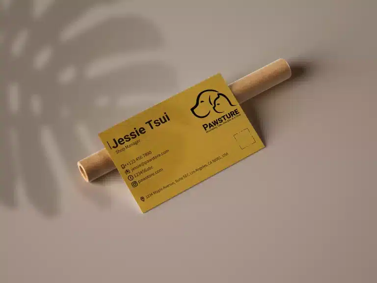 A playful pet shop business card design featuring a yellow background with subtle bone patterns, complemented by bold black text for clear and eye-catching communication.