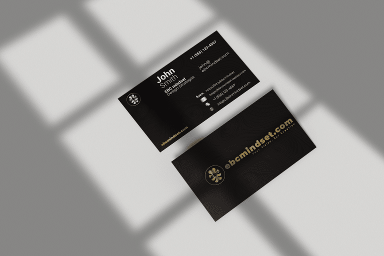 A luxurious business card design with a sleek black background, featuring a gold foil and silver foil logo with crisp white text for a sophisticated and professional look.